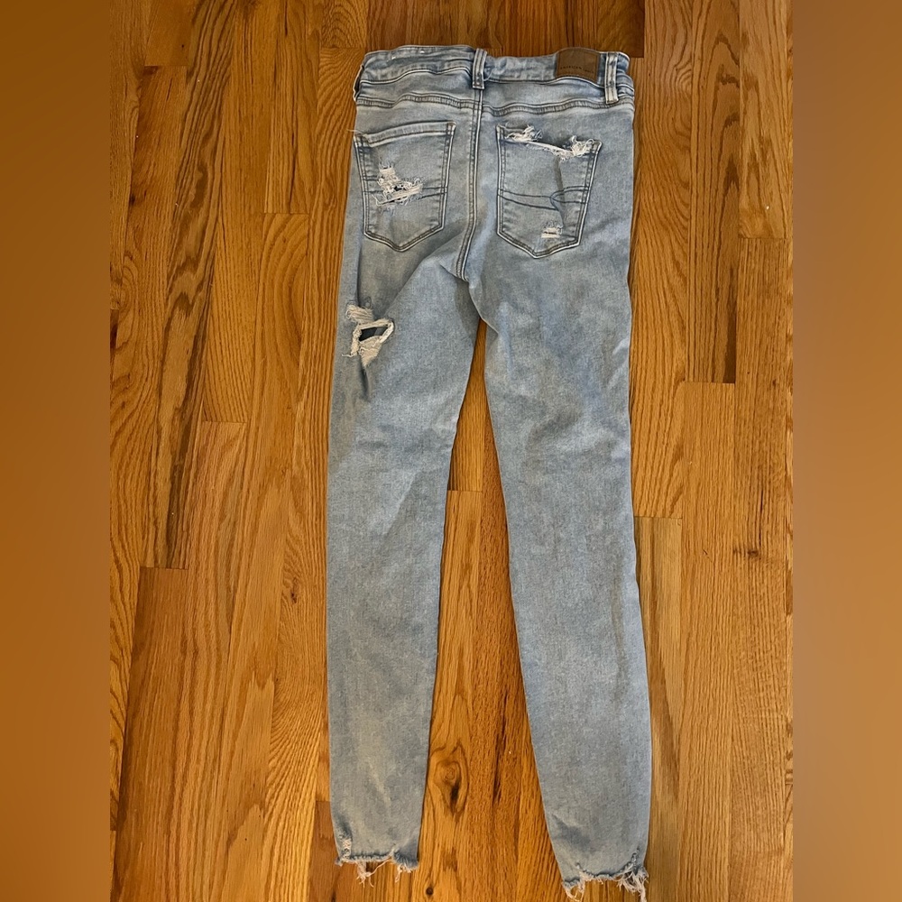 American Eagle next level stretch hi rise jegging. Ripped light blue. Size 4